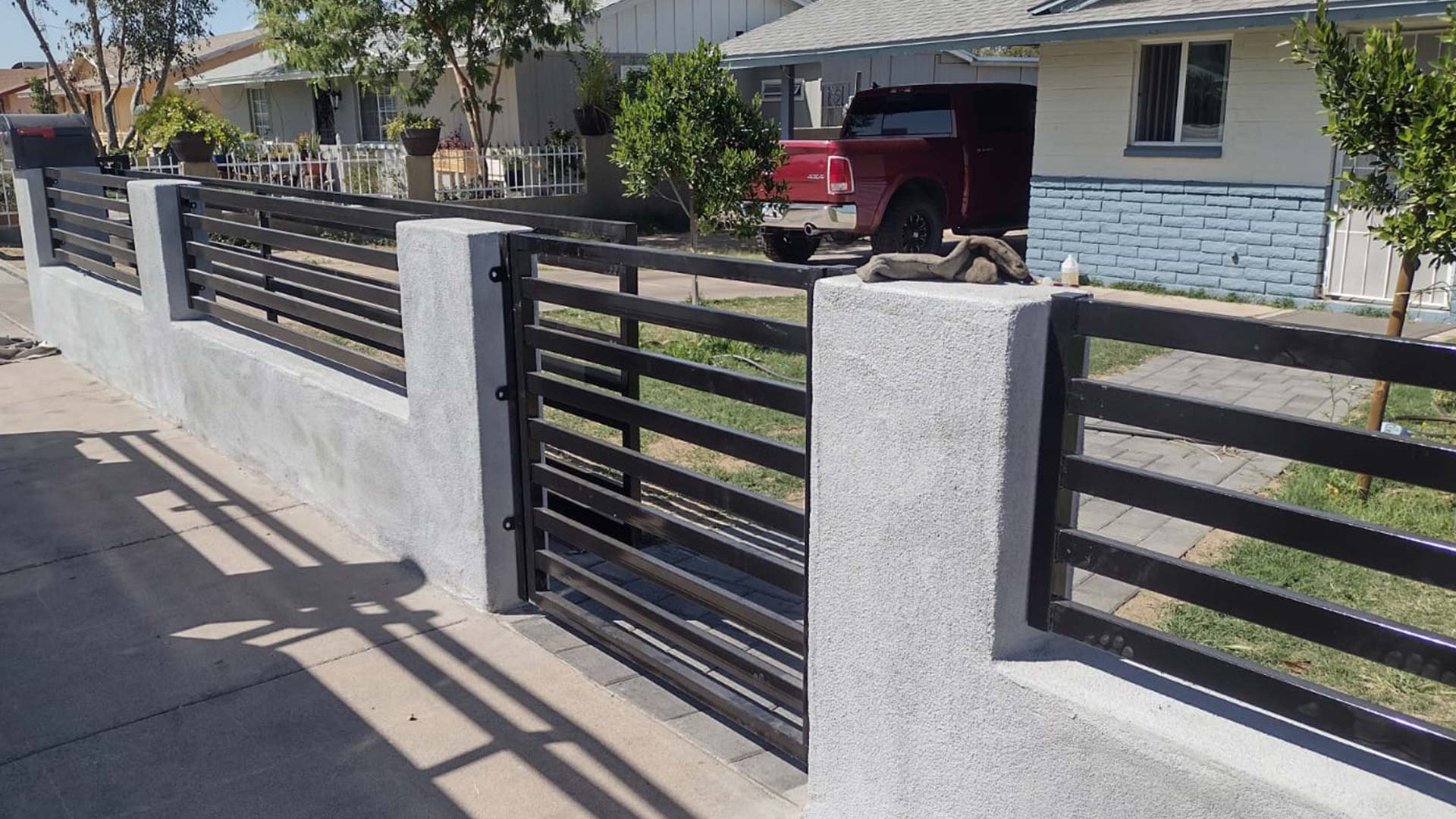 black iron custom fence and door installed at house front entrance phoenix az